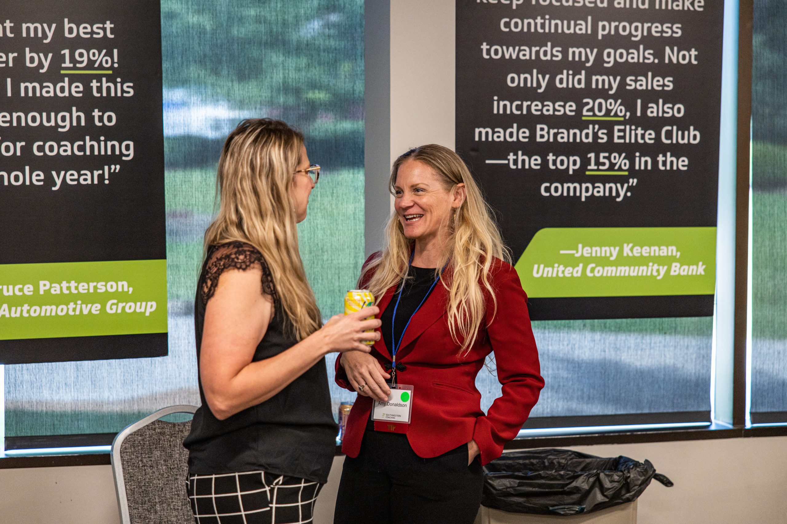 Coworkers chat during a break in a training event