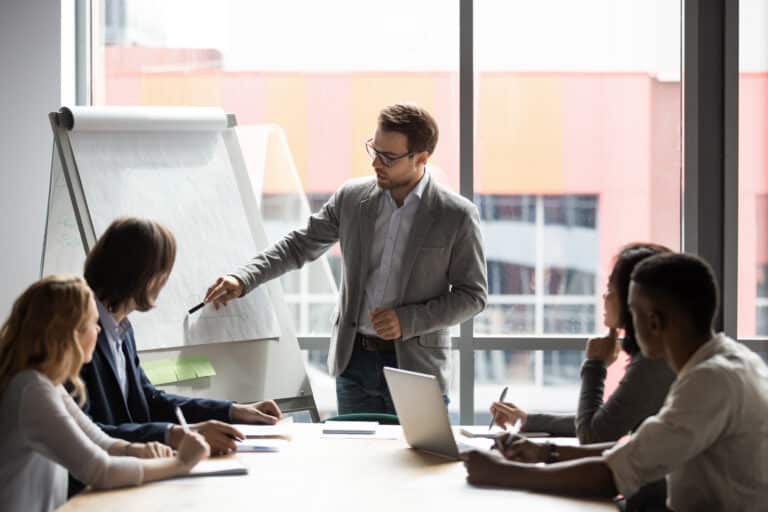 man presenting to group