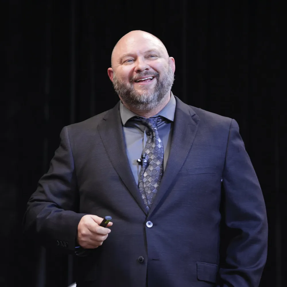 sales coach presenting on stage