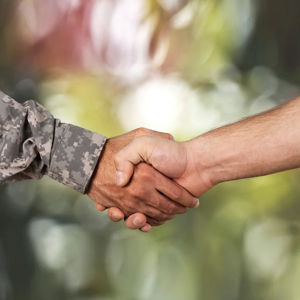 veteran shaking hands with civilian