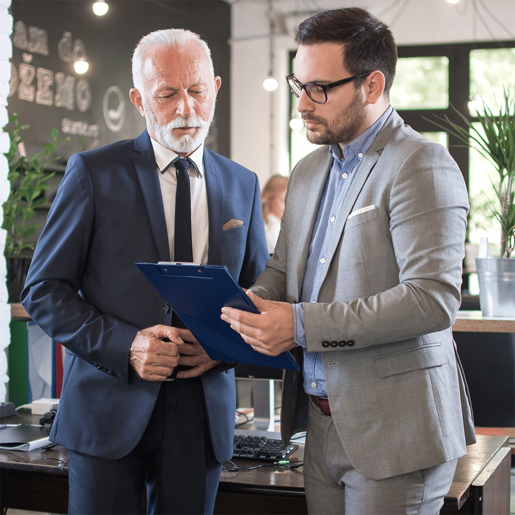 business people discussing a document